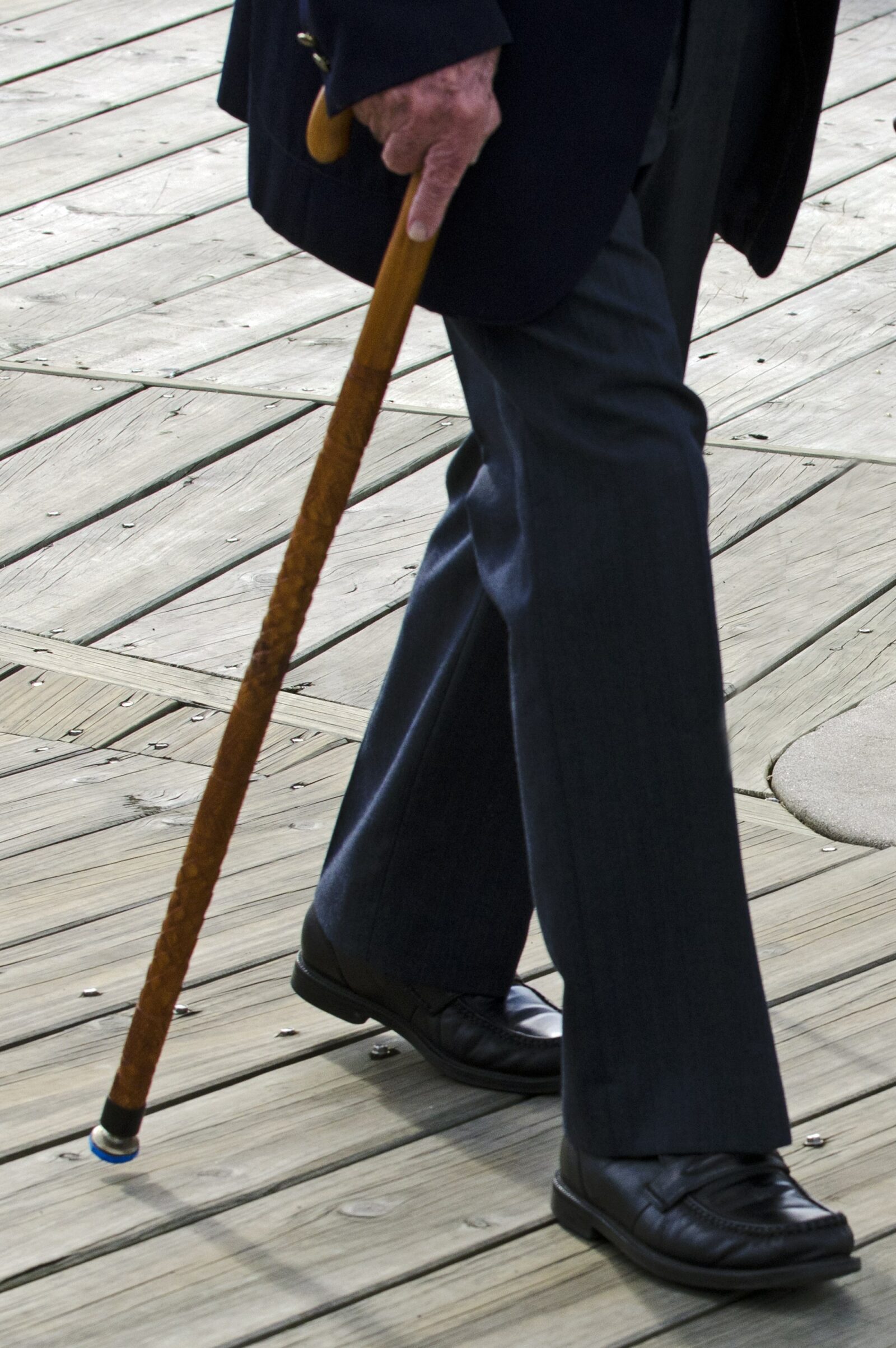 lower half of a man walking with cane