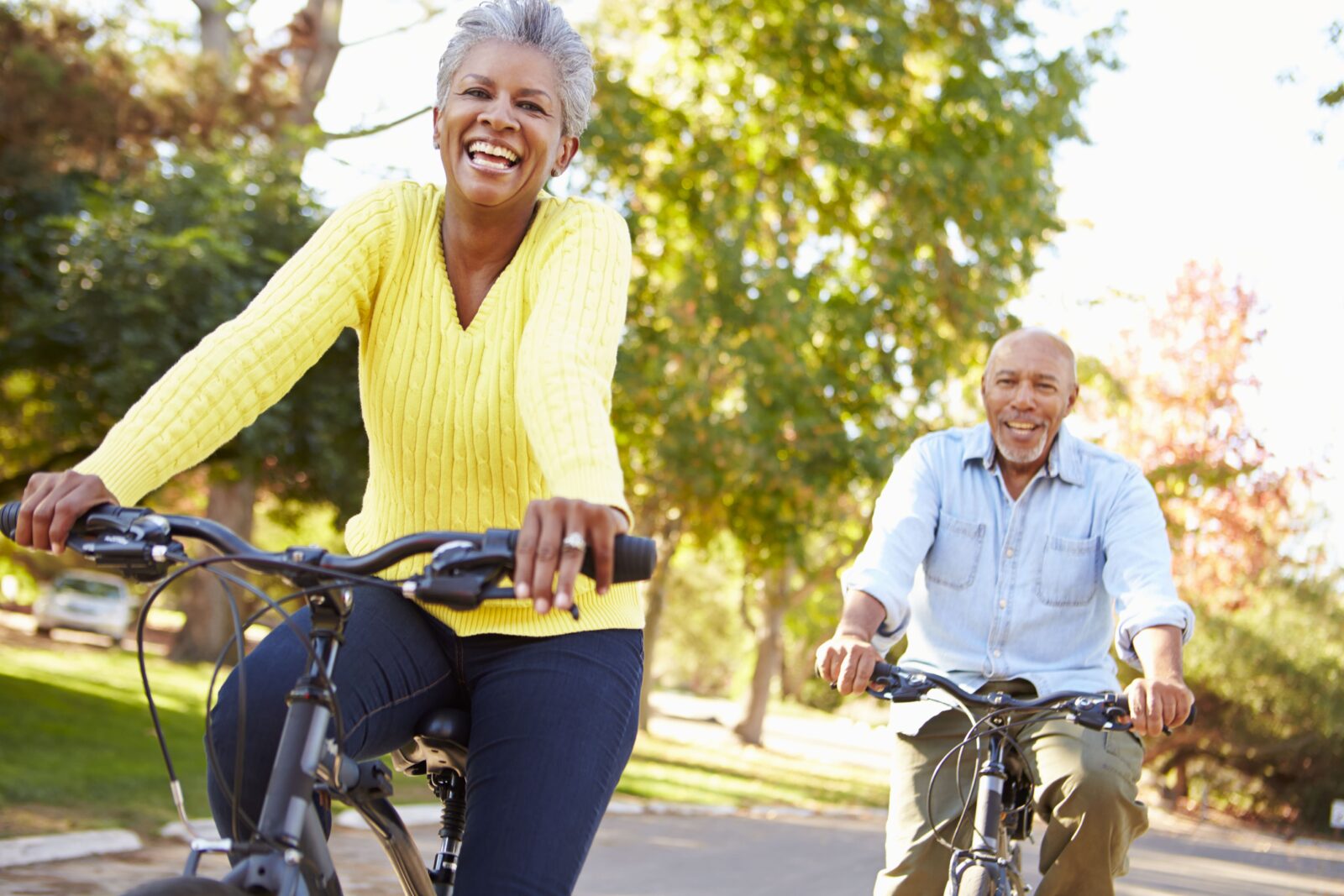 older man and woman bike riding